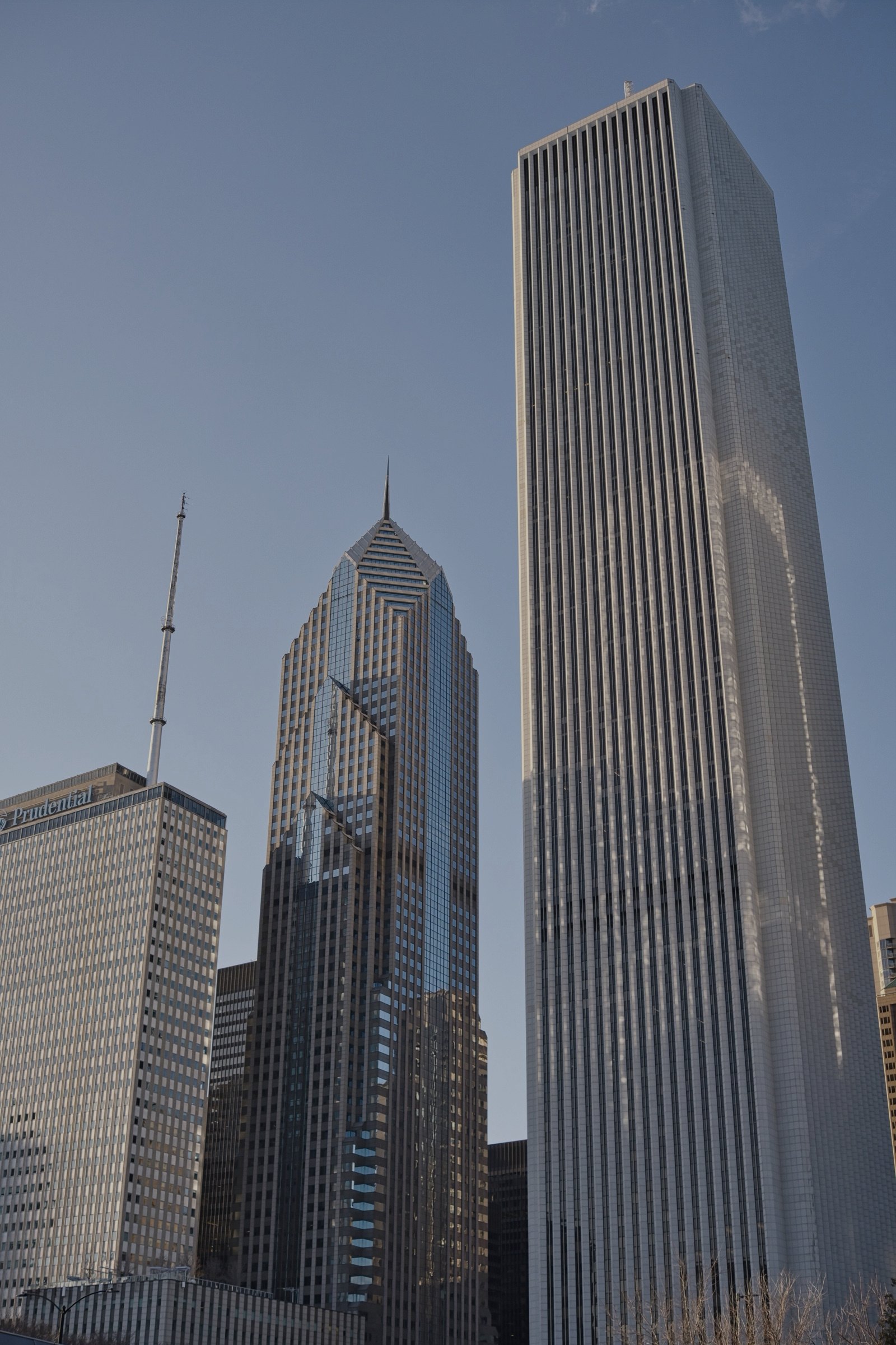 Aon Center rising above Chicago, photographed from street level